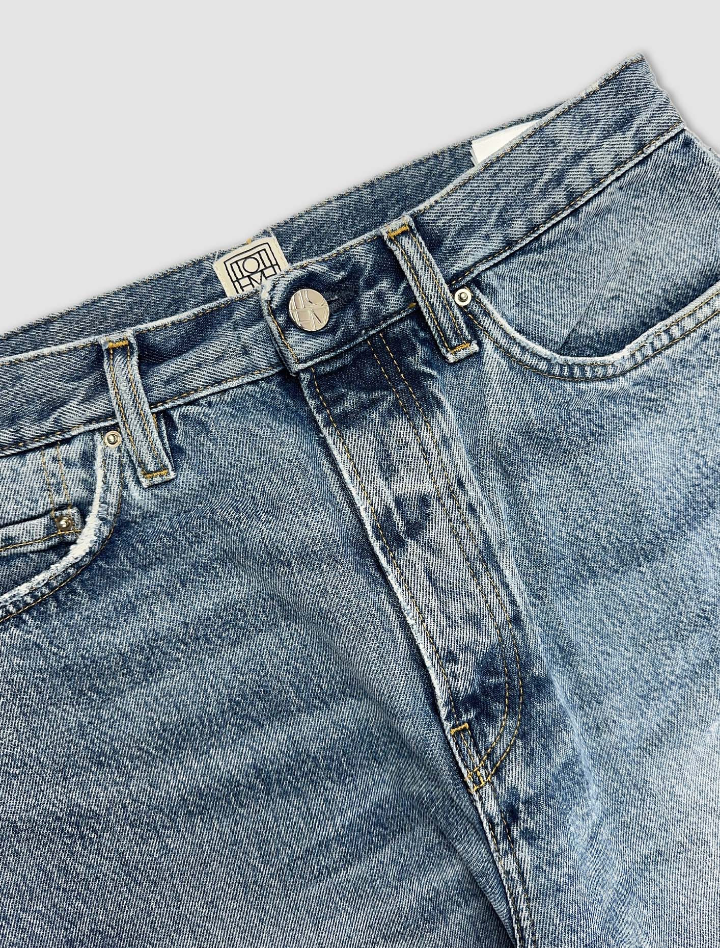 Shop Totême Twisted Seam Denim In Worn Blue