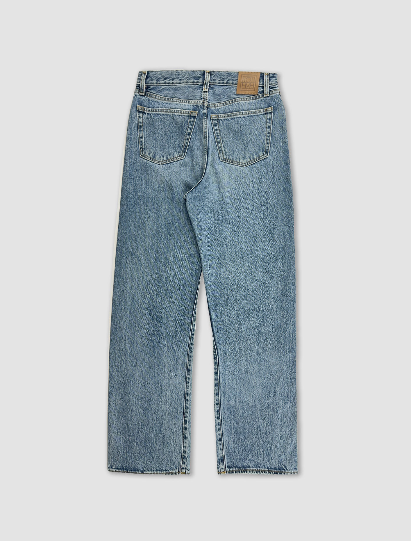 Shop Totême Twisted Seam Denim In Worn Blue