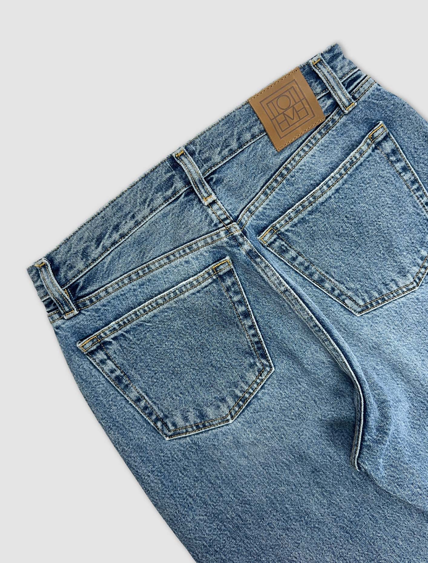 Shop Totême Twisted Seam Denim In Worn Blue