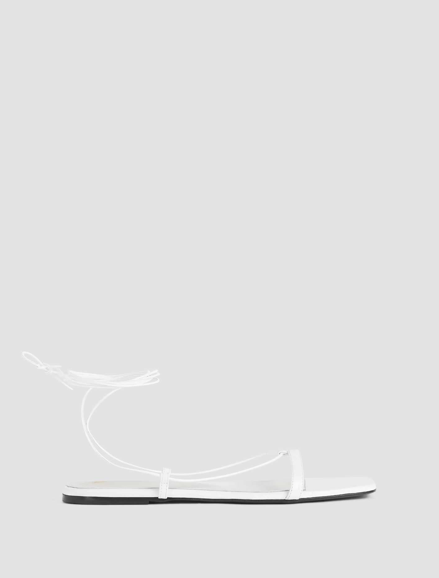 Shop Totême Croco Tie Sandal In White