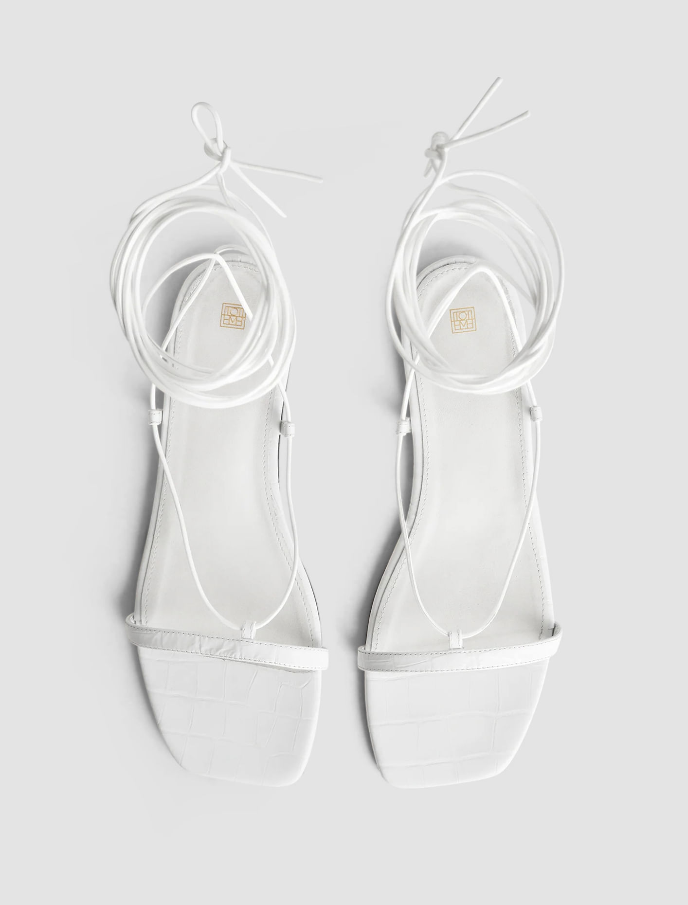 Shop Totême Croco Tie Sandal In White